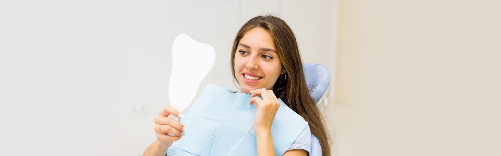 Happy girl during oral surgery at Brantford dental clinic